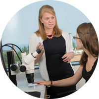Student conducting research with professor Student conducting research with professor