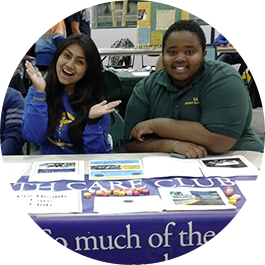 Two students sitting at a table during Student Involvement Day