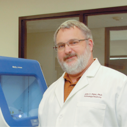 Biology and zoology alumni, John Planz in his laboratory