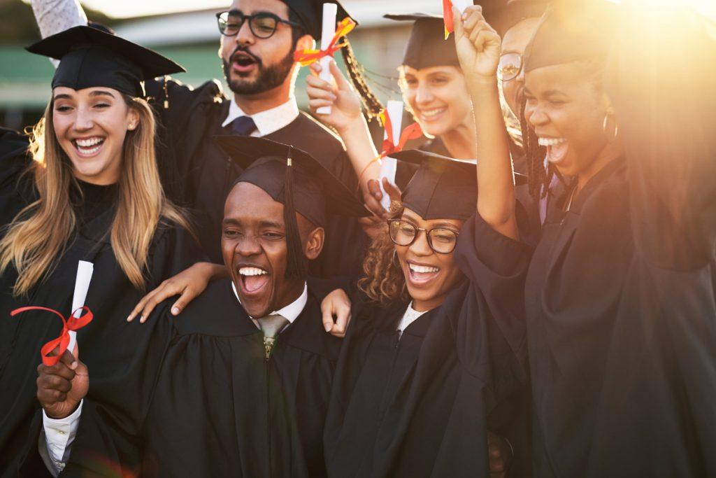 Diverse students in graduation apparel