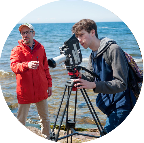 Students shooting a film at the edge of Lake Ontario