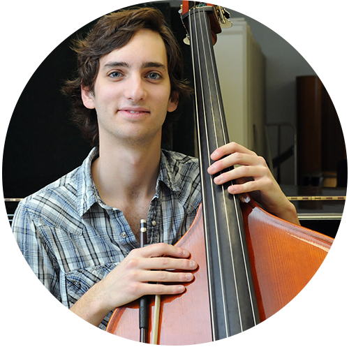A music student poses with his bass