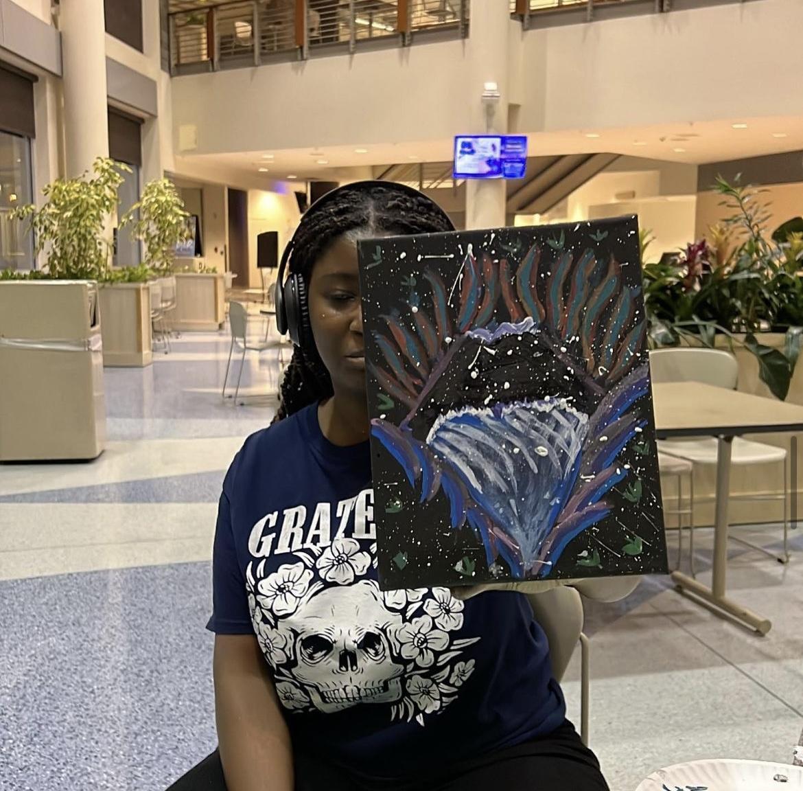 cstep student with her painting