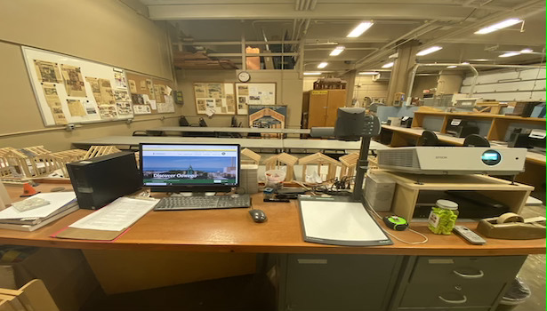 Photo shows the podium equiptment including professor PC, document camera and 1 projector. 