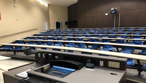 Photo of the classroom podium and front of the room. 