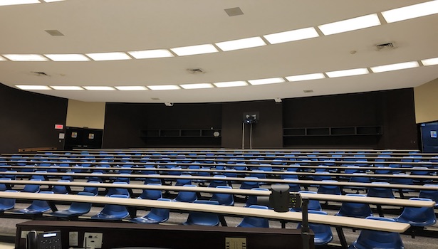This photo shows the seats in the room from the podium perspective. Including the projector in the back of the classroom. 
