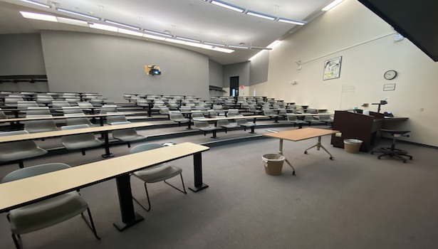 Photo shows the classroom from the front. Including student chairs and podium. 