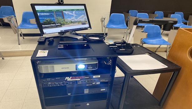 Close up photo of the professor cart in the classroom. 