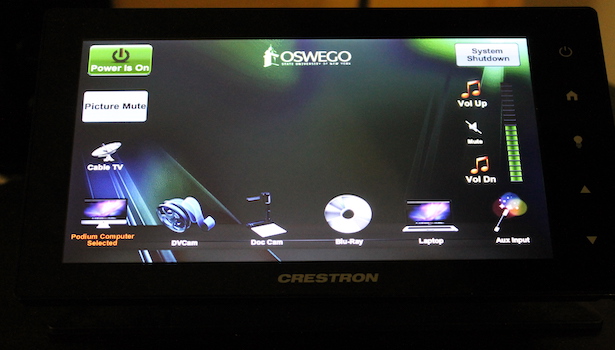 This is a photo of the touch panel. Including turning projector on/off and all of the input sources. 