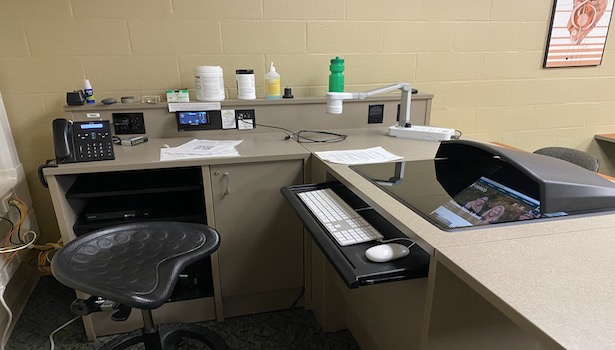 Photo shows the faculty podium including updated document camera, monitor and podium MAC.