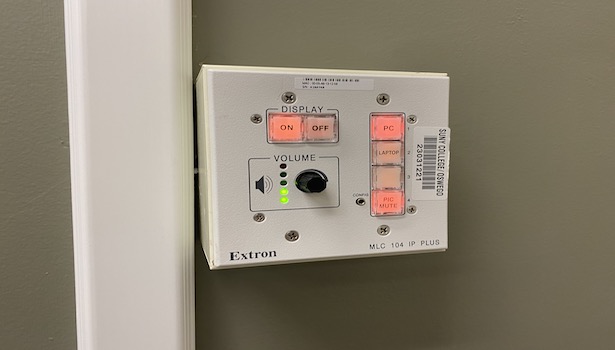 Photo shows the extron panel in this room. 