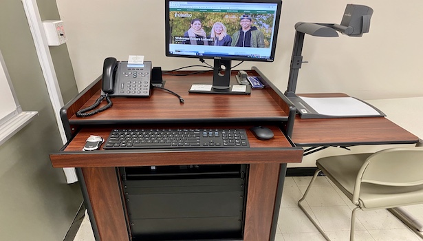 Photo showing the podium in this room including the PC, Doc cam and laptop connection. 