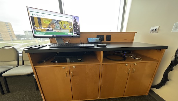 photo of the podium in the classroom showing the PC, keyboard and mouse. 