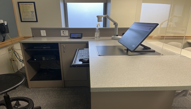 Photo of the podium in the classroom including document camera and PC. 