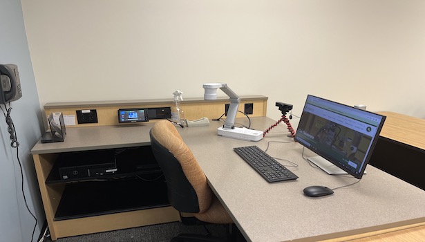 photo of the podium in classroom including document camera PC and Blu Ray player