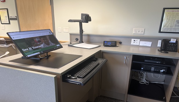 Photo shows the podium equiptment including Monitor, PC, document camera and blu-ray player