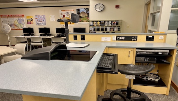 This photo shows the podium with all of its equiptment. Including VCR player, podium PC and the document camera. 