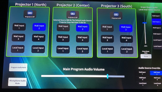 Photo showing the touch panel to change inputs in the closet of the room. Showing all 3 projectors and audio volume control. 