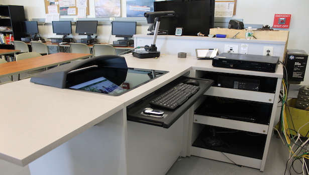 Photo of classroom podium with the technology on it. 