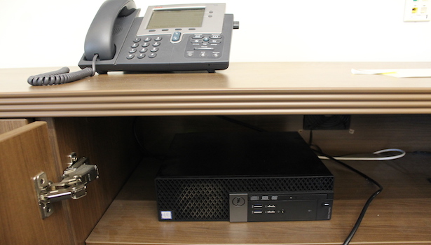 Photo of the technology in the room including the phone/PC.
