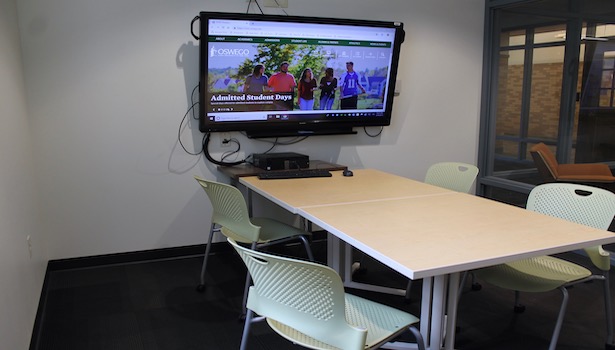 Photo of the room with the table, and the flat panel television