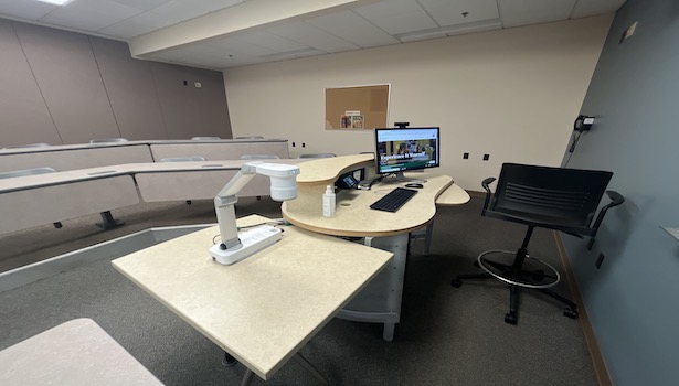 photo of the podium in classroom including document camera PC and Blu Ray player