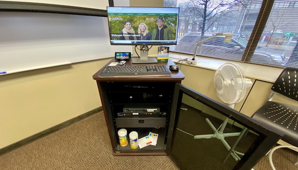 Photo of the podium in the classroom with the PC, Touch Panel and wireless KB/M