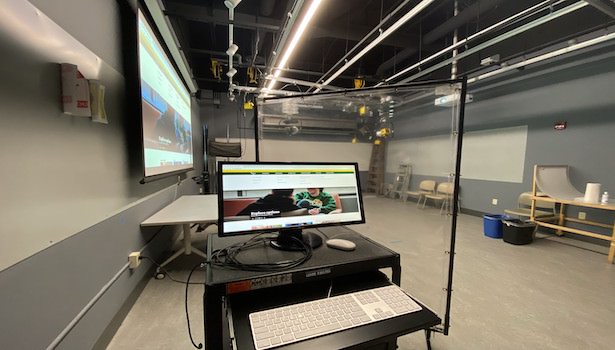 Photo shows classroom and MAC from opposite side showing projector screen as well. 