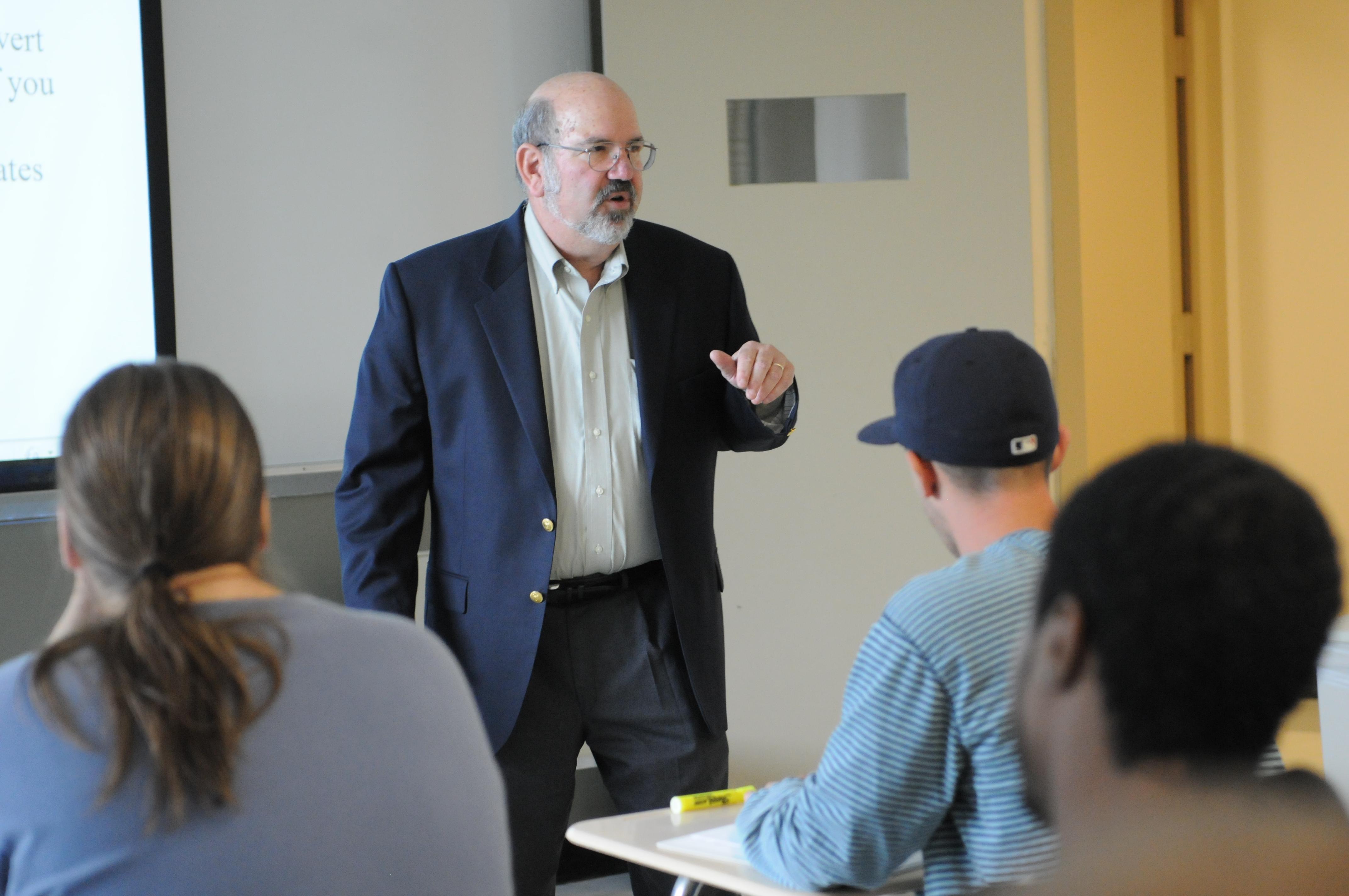 Professor Lawrence Spizman lecturing in a classroom