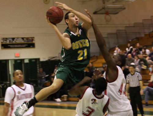 Chad Burridge goes to the hoop in Laker basketball game