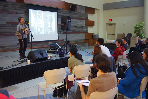 Natalia Serna performs at a Songs of Migration event.