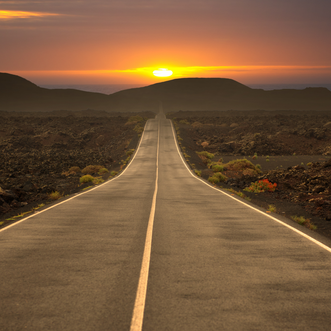 GRAPHIC: A road leading into the sunset. ACTION: What to expect when abroad guide.