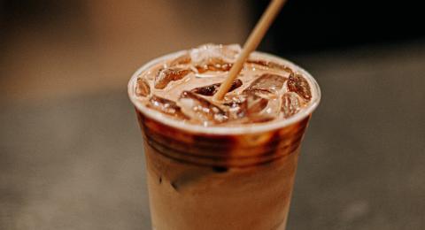 Cup of iced coffee with straw