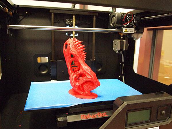 3D-printed dinosaur skull, still on the 3D printer&#039;s build plate.