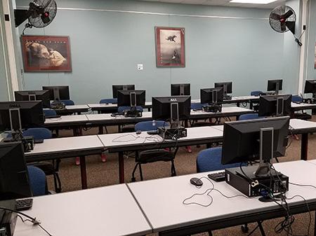 Penfield Classroom 101 has rows of seating at long tables.