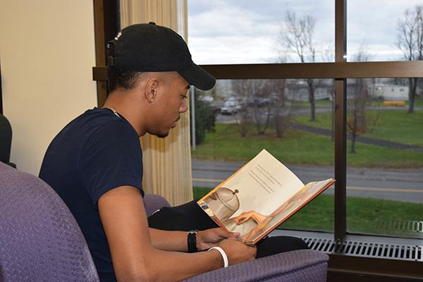 student reading a book.