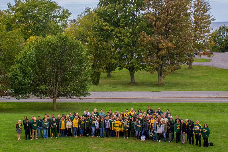 Campus community members in green and gold