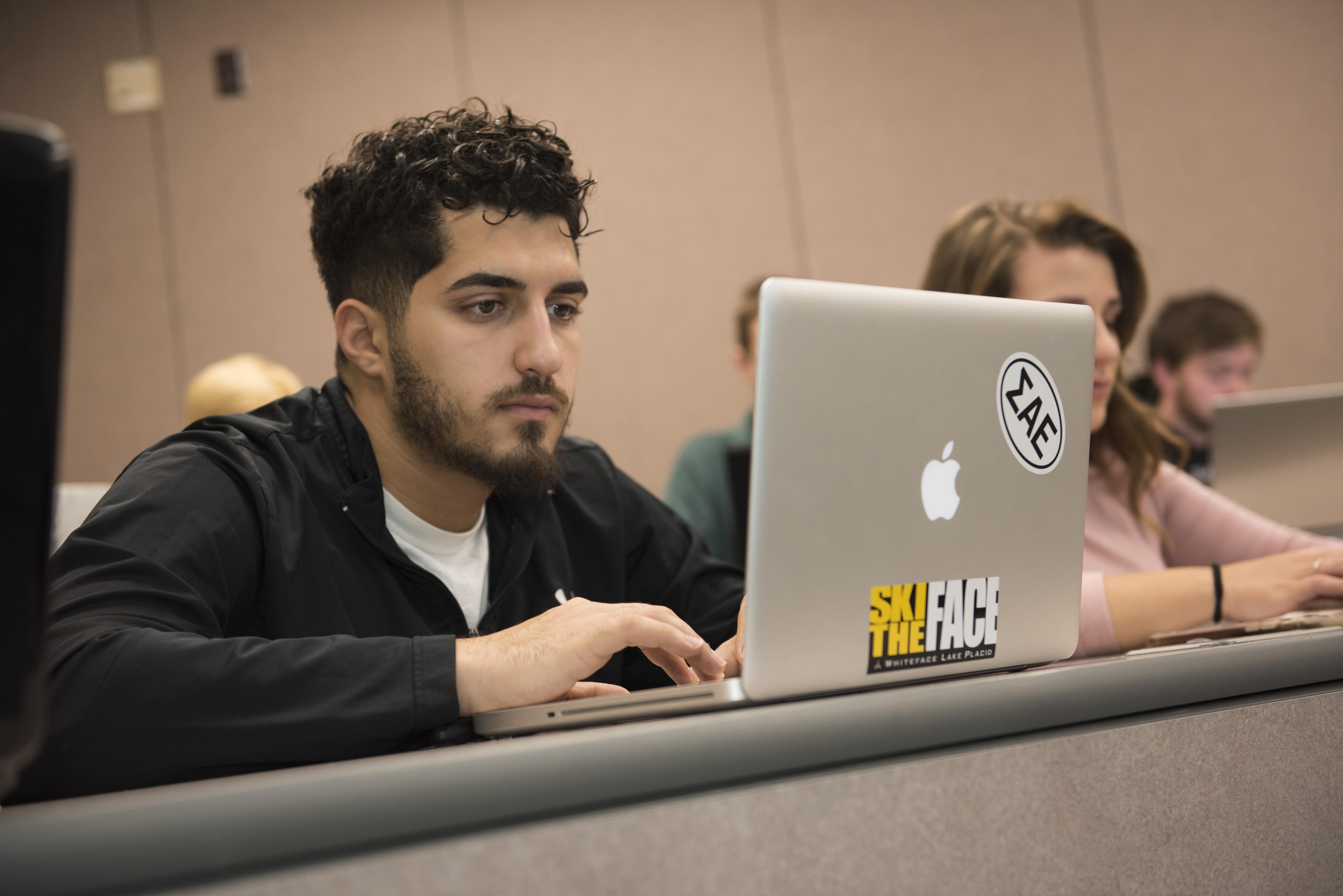 Student taking notes in class