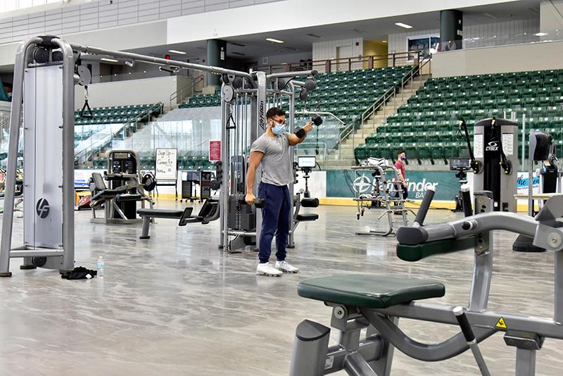 Students use the Fitness Centers relocated into Marano Campus Center arena