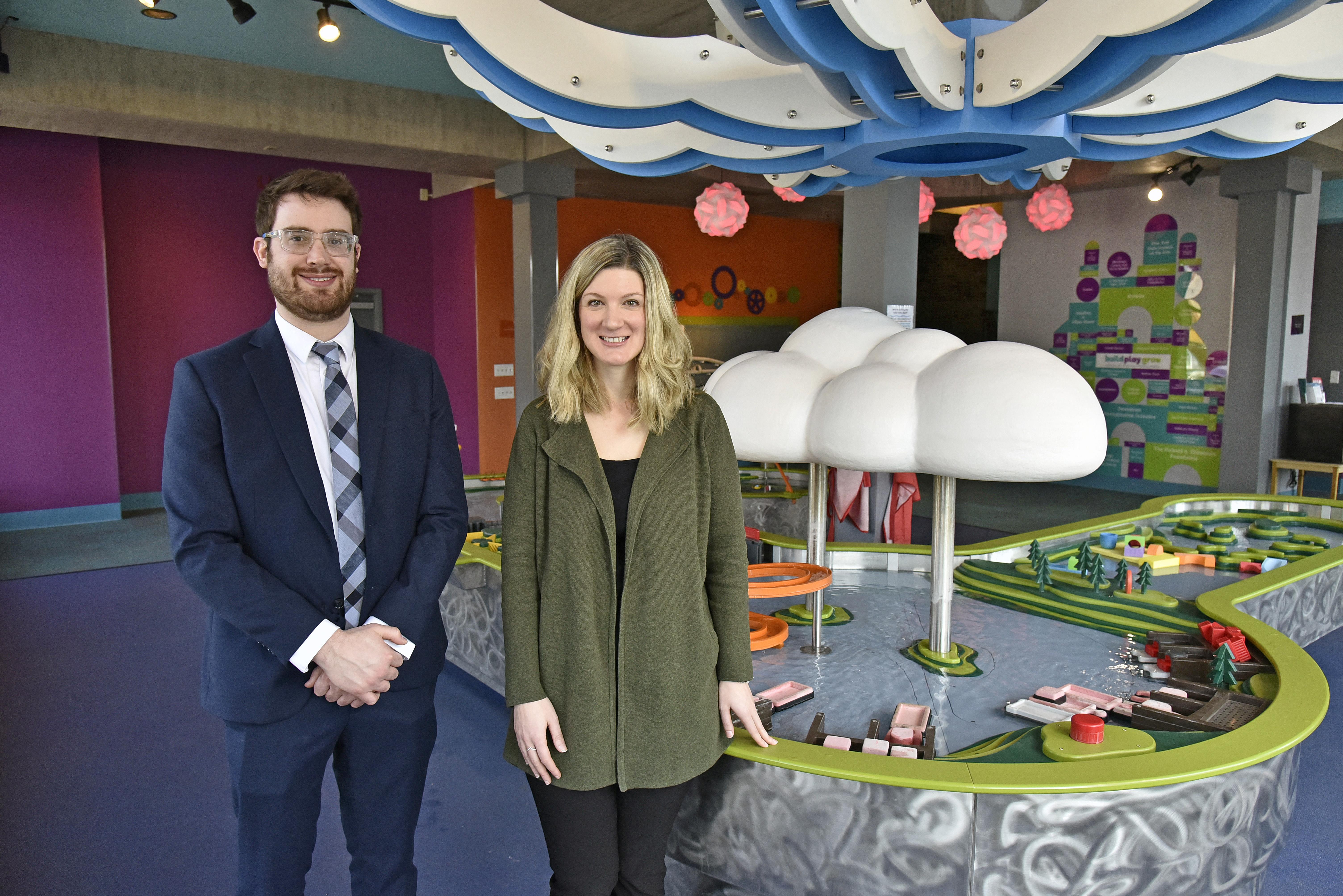 Professor Zachary Gold and Executive Director Kathryn Watson on the first floor of the Children's Museum in front of the water table