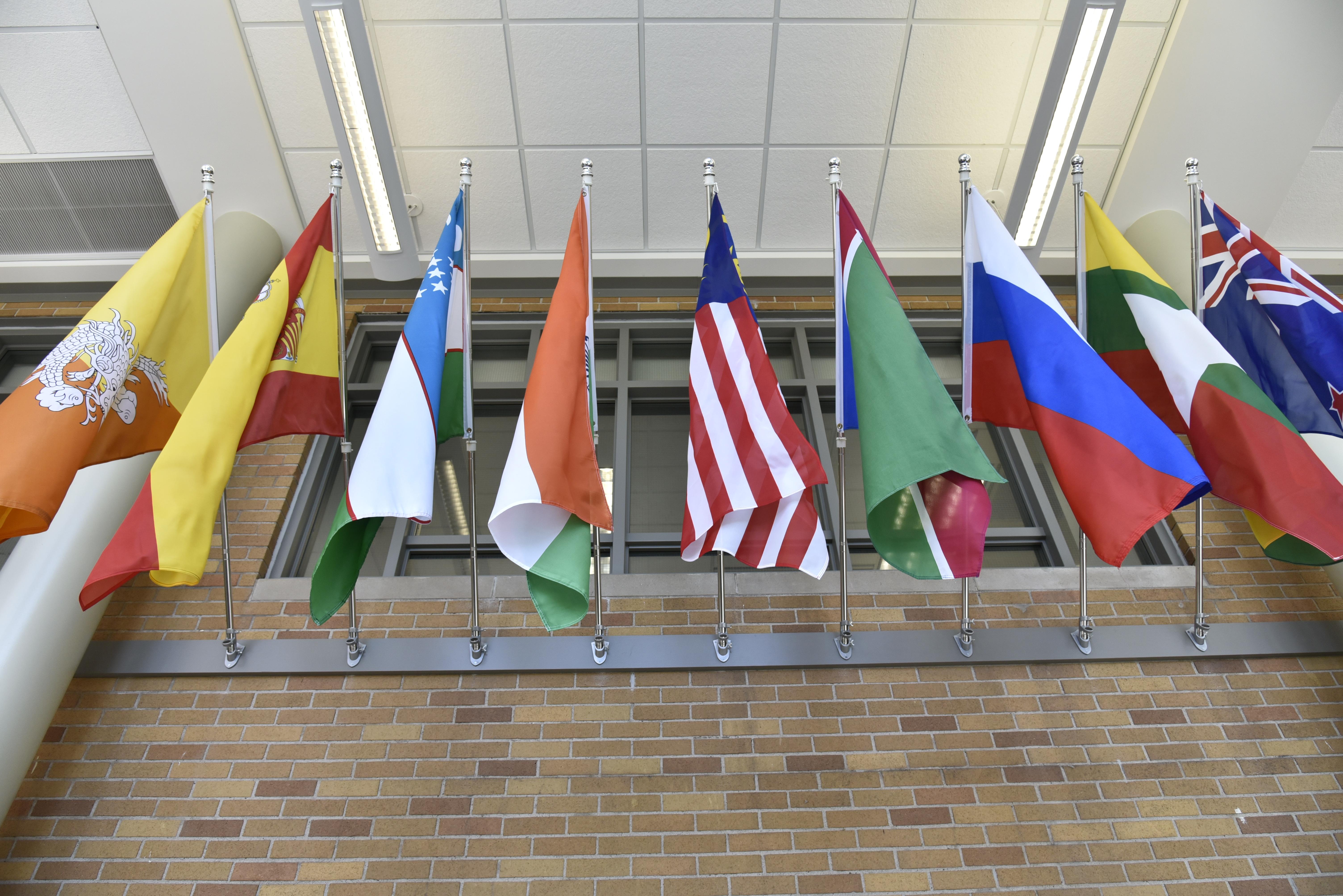 Some of the flags in the Flags of Nations display in the Marano Campus Center at SUNY Oswego