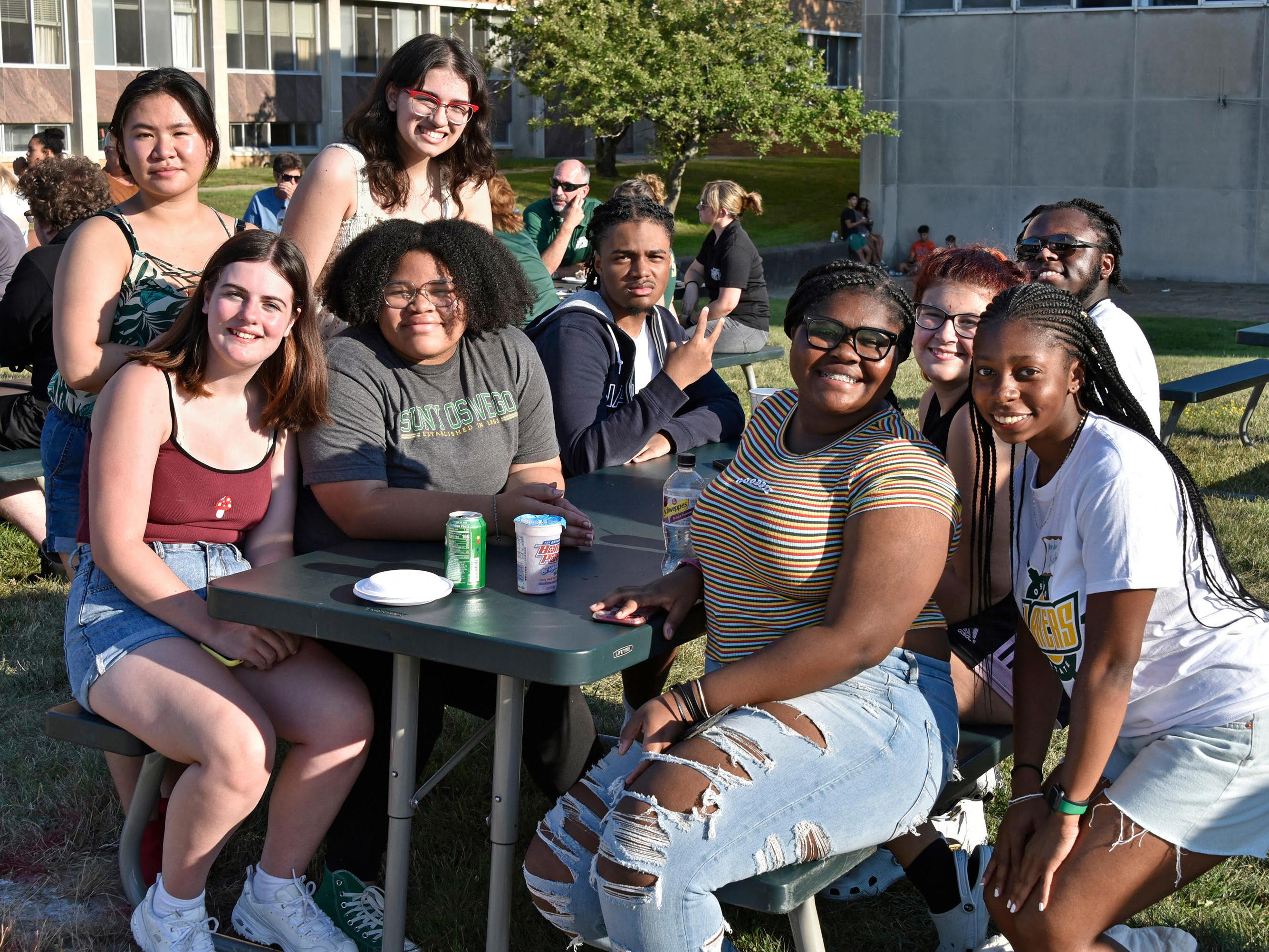 Newer students enjoying the welcoming picnic