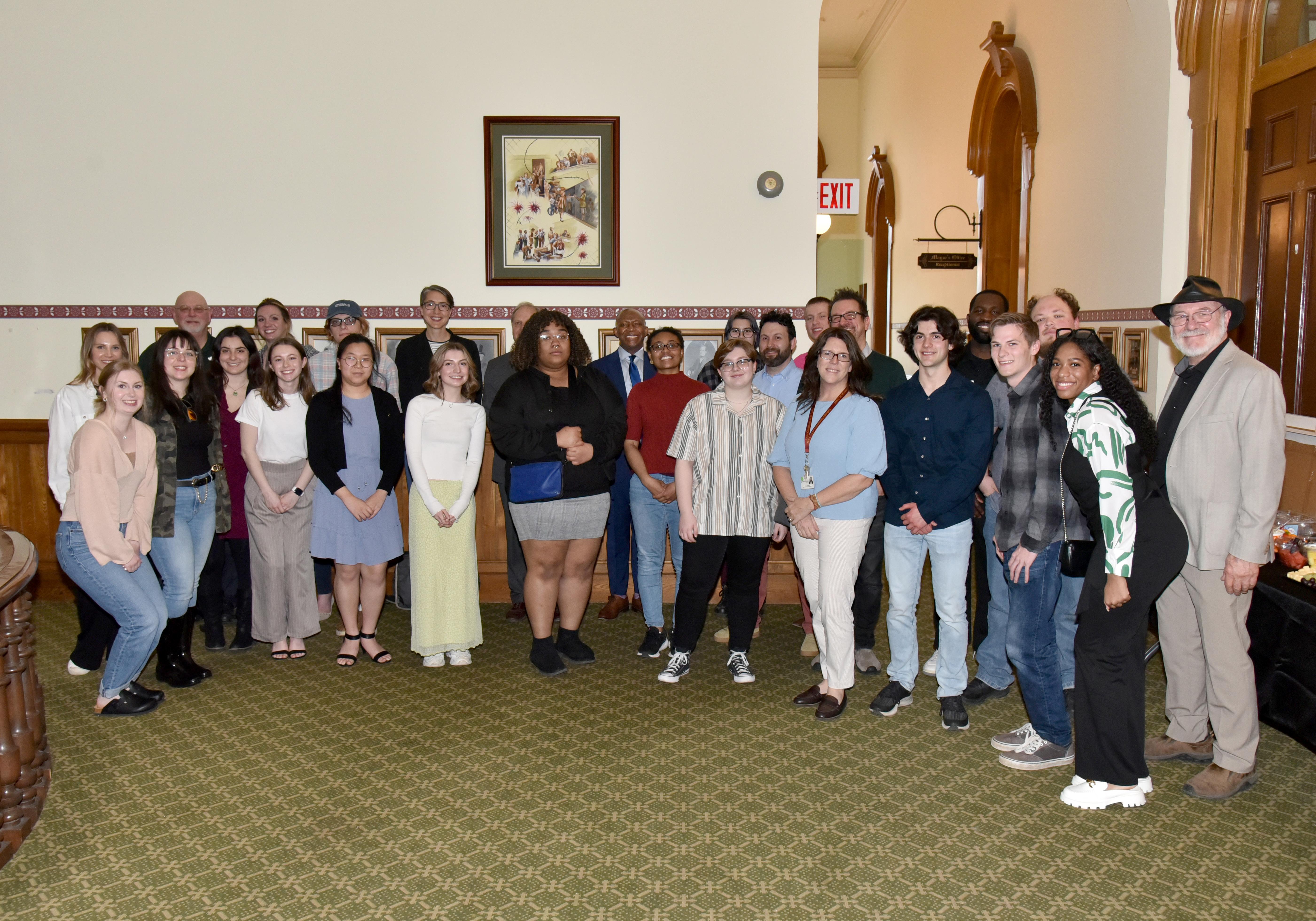 Participants and partners in the campus-community initiative ‘One City. One Campus. One Community’ gather at a May 1 reception in Oswego's City Hall