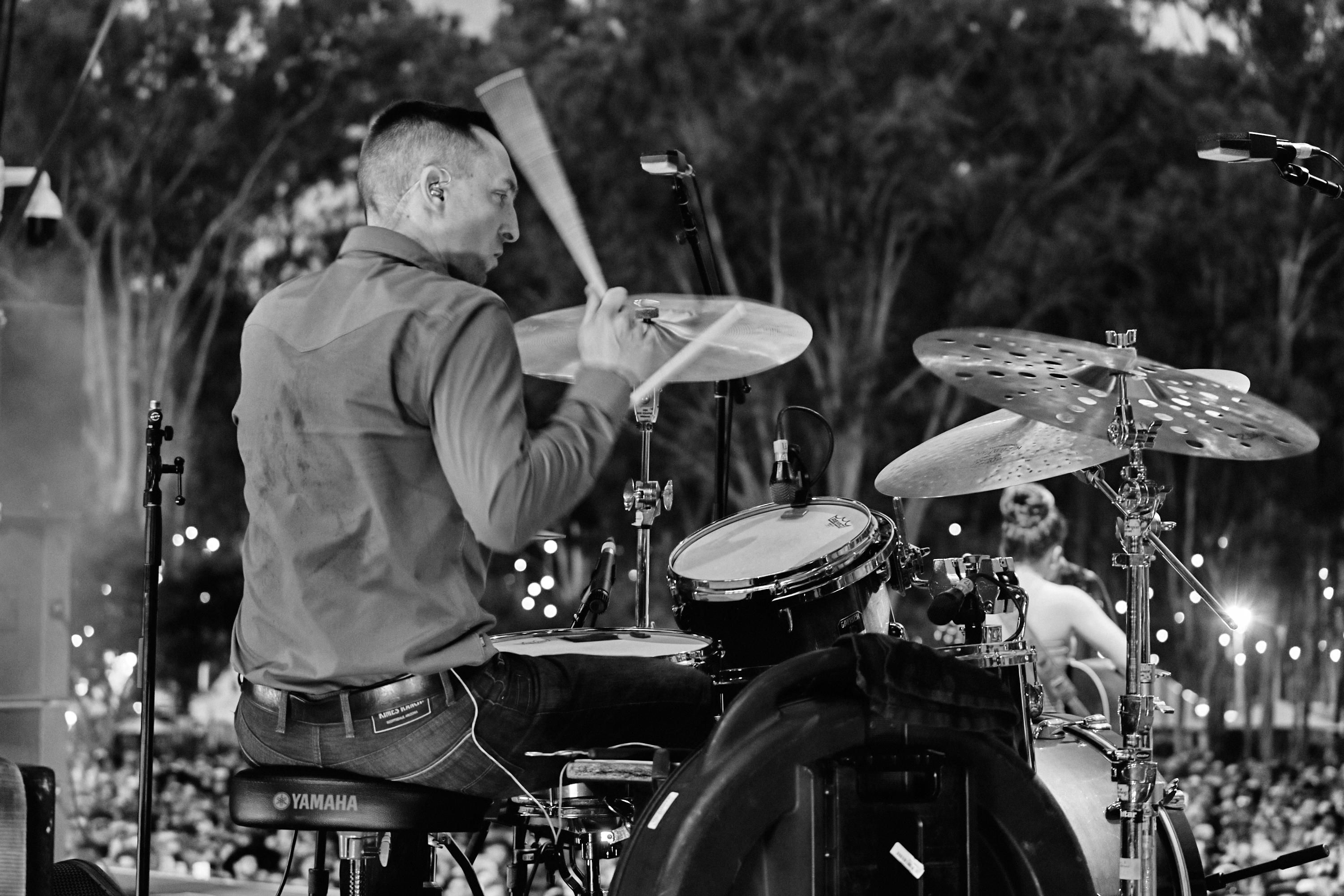 Nate Felty '12 playing drums at CMC Rocks Festival in Brisbane, Australia
