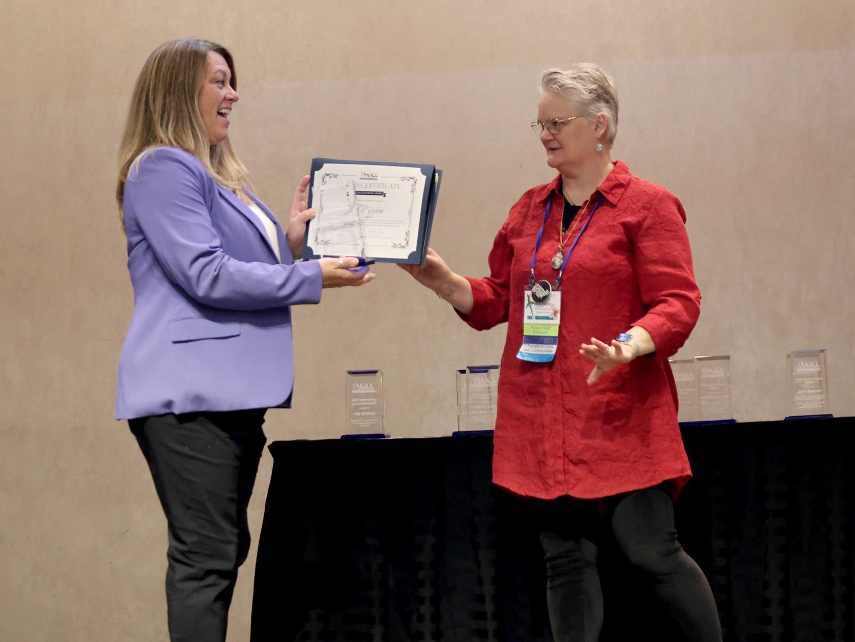 Jill Pippin receives an AAACE award for SUNY Oswego's integrative professional studies program
