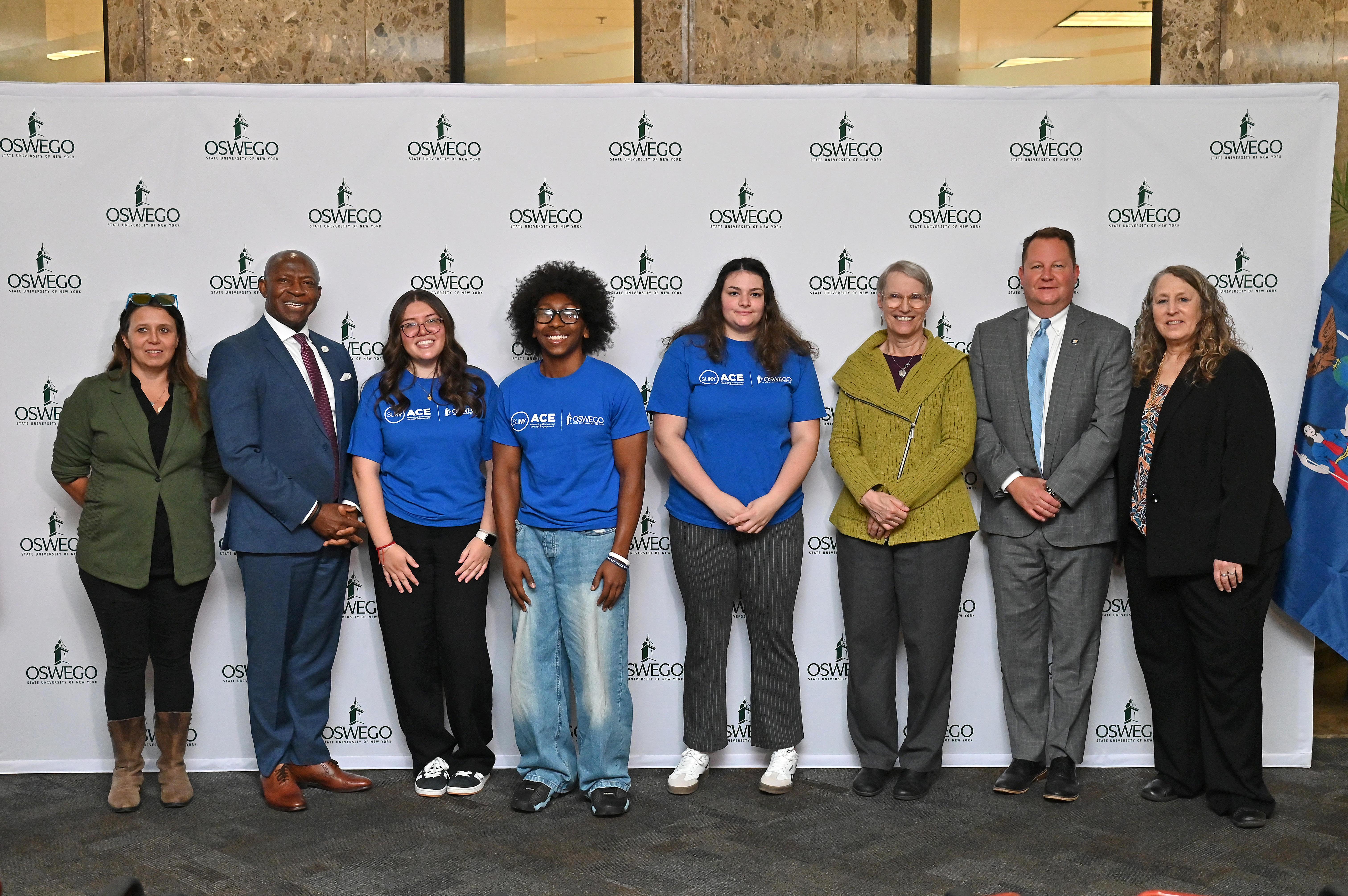 ACE students, Oswego administrators, local officials and Donna Linderman from SUNY