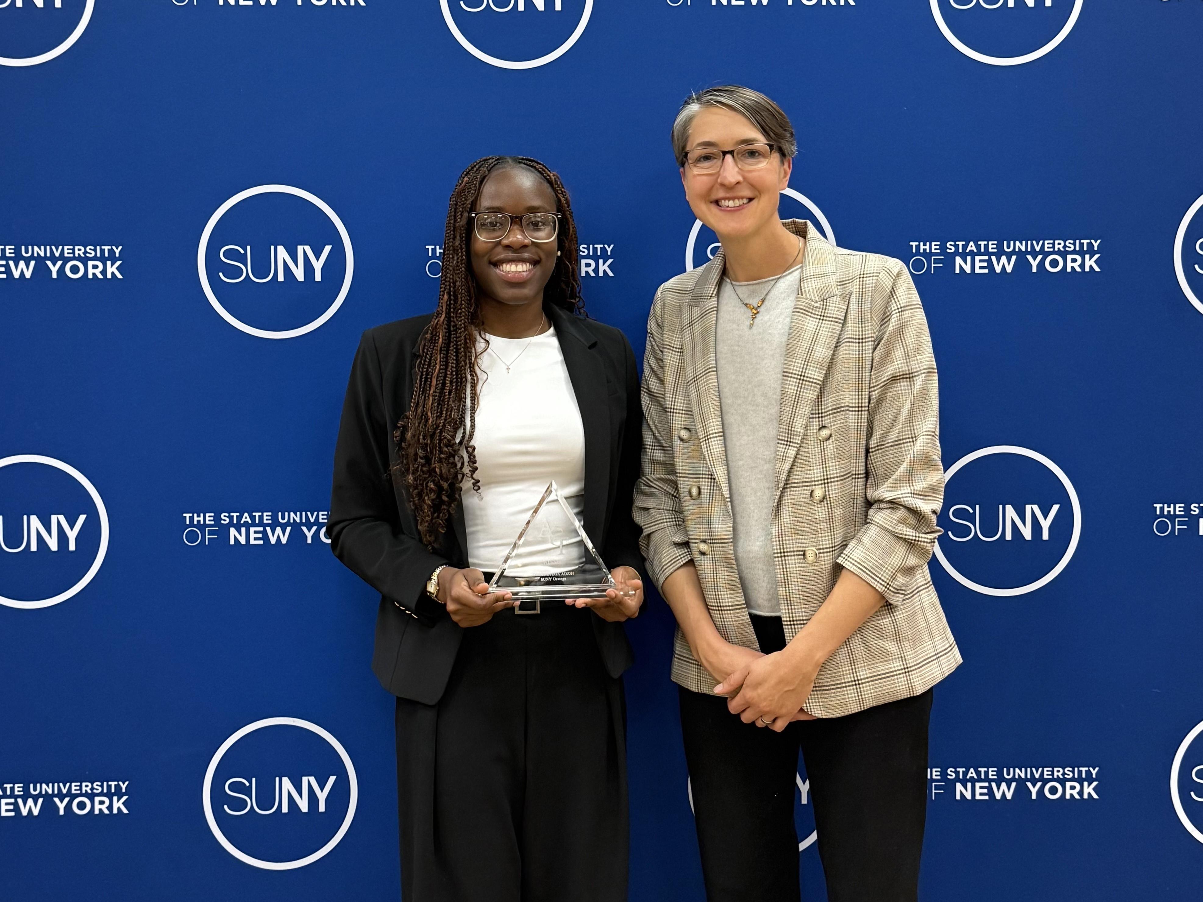 SUNY Oswego Student Association President Oghenetega Adjoh earned the ACT (Association of Council Members and College Trustees) Scholarship for Excellence and Student Initiative, joined by Kristi Eck for the presentation