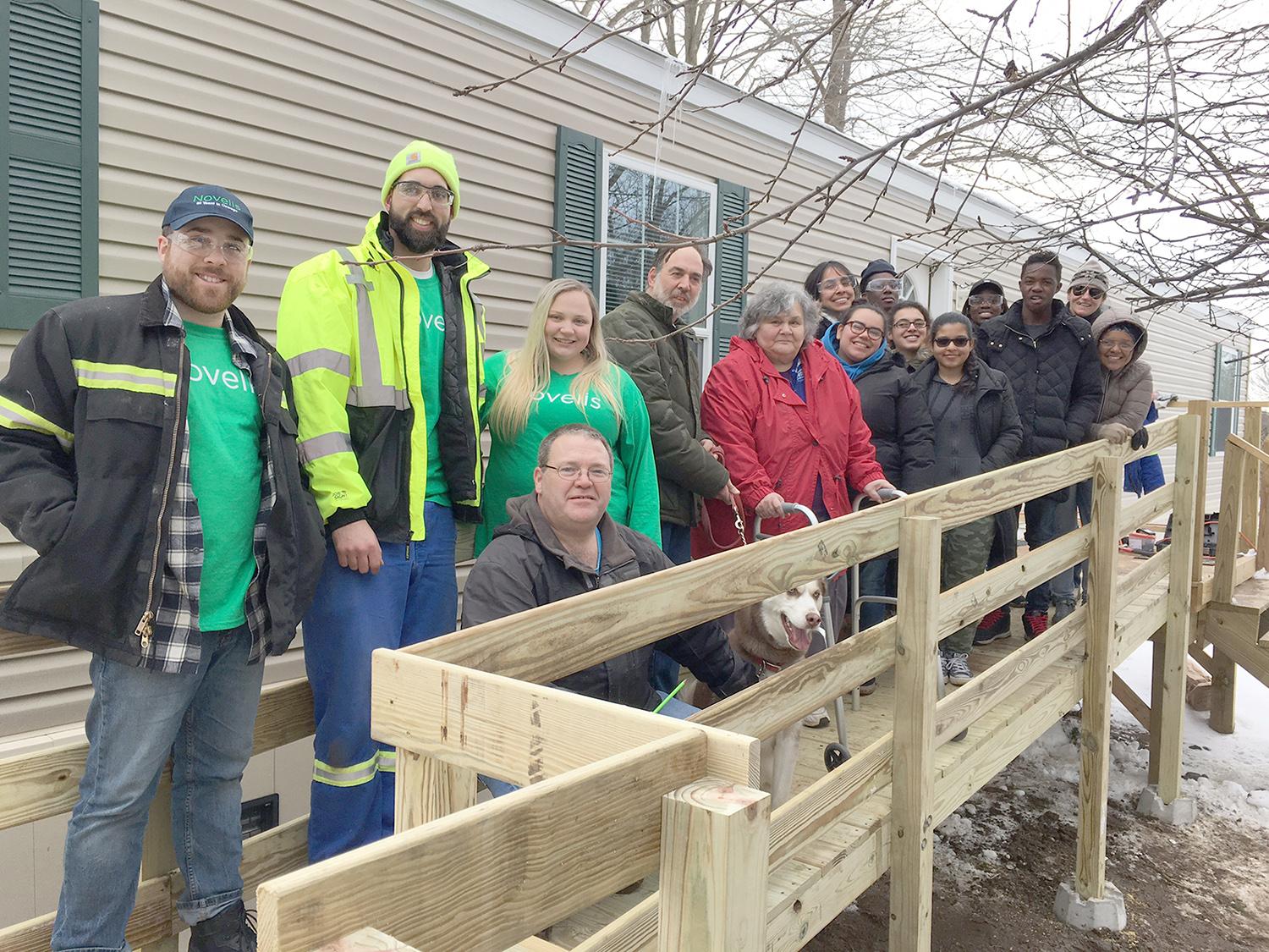 Students work with Novelis employees to build ramps for ARISE