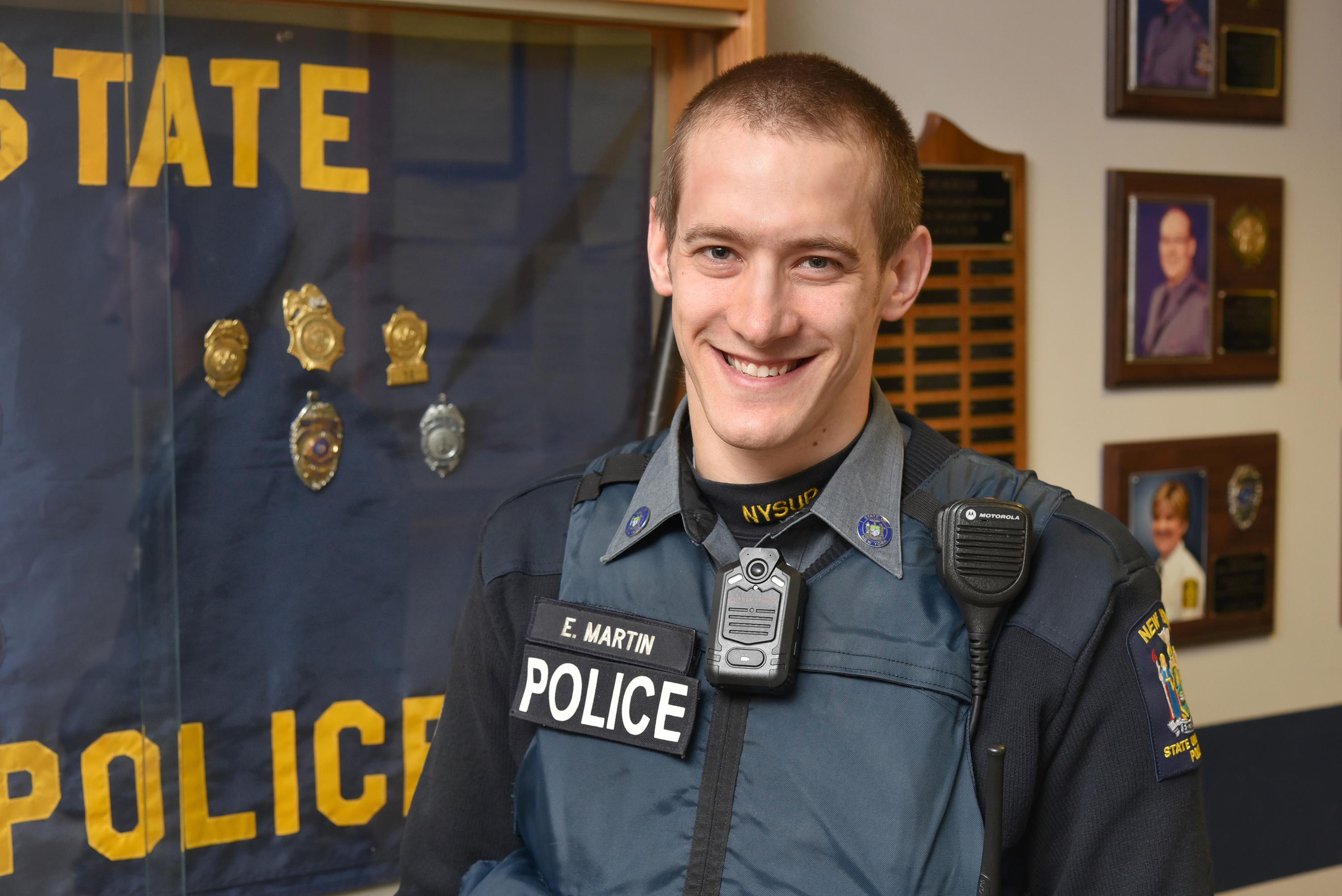 University Police Officer Eric Martin showing body-worn camera