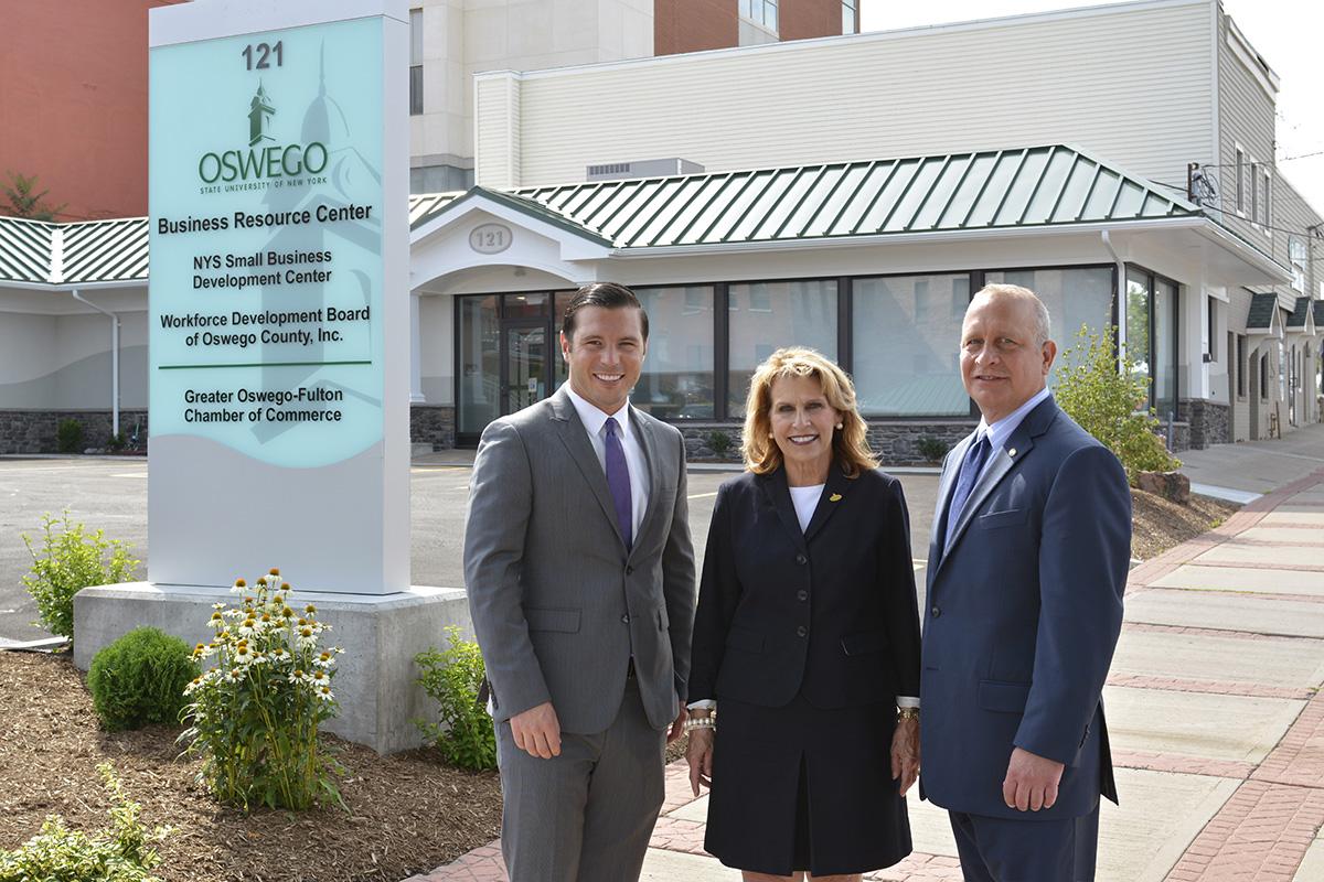 Oswego Mayor William J. Barlow Jr., SUNY Oswego President Deborah F. Stanley and Pathfinder Bank President Thomas W. Schneider, fronting the college's new Business Resource Center in Oswego